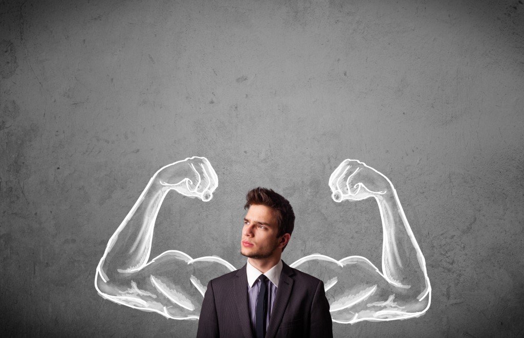 Businessman with strong muscled arms